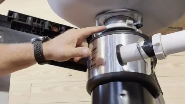 Garbage disposal unit being aligned with the sink flange during installation