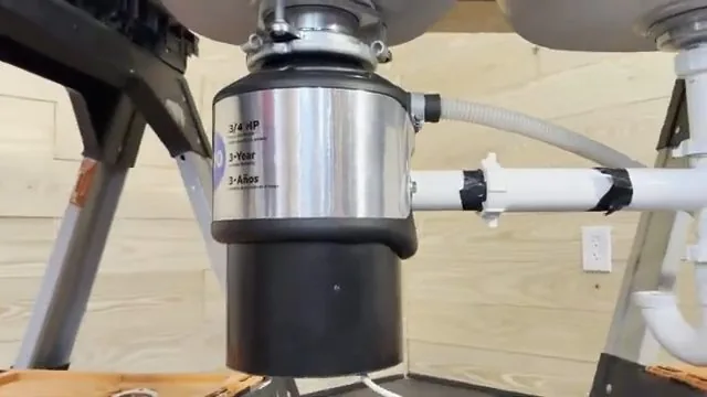 Discharge pipe being attached to a newly installed garbage disposal