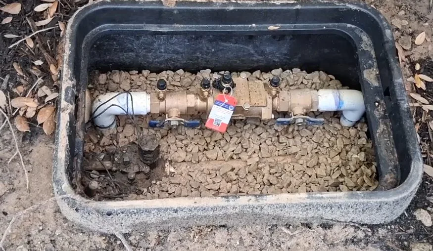 Backflow valve installed inside a below-grade valve box