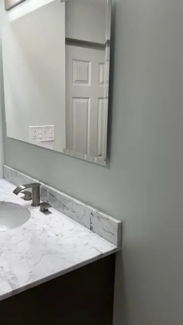 Bathroom vanity and toilet installed after a remodel