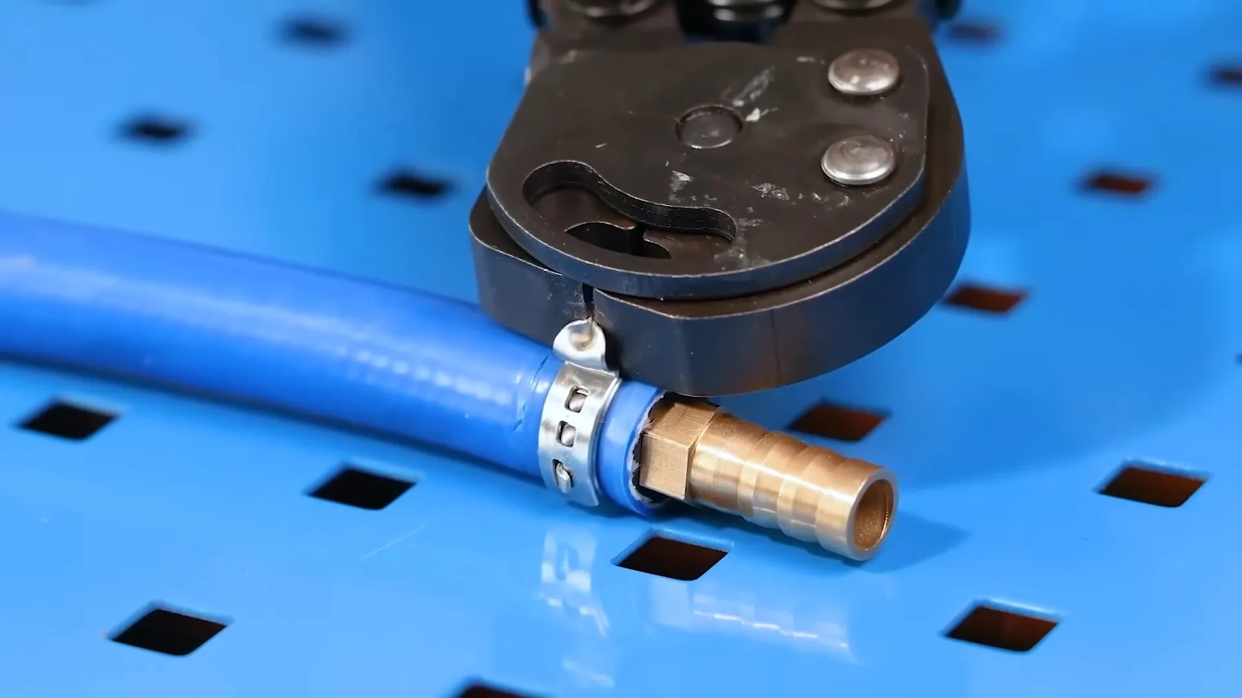 Pipe cutter positioned on a short section of metal pipe