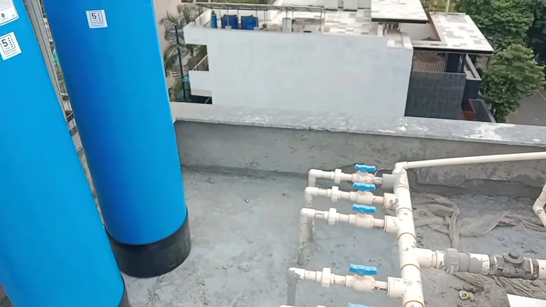 Water softener unit installed against a utility wall