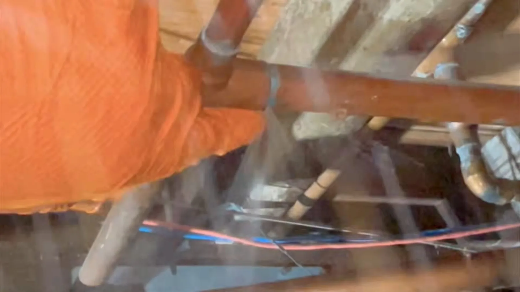 Broken pipe found beneath a floor inside a crawlspace