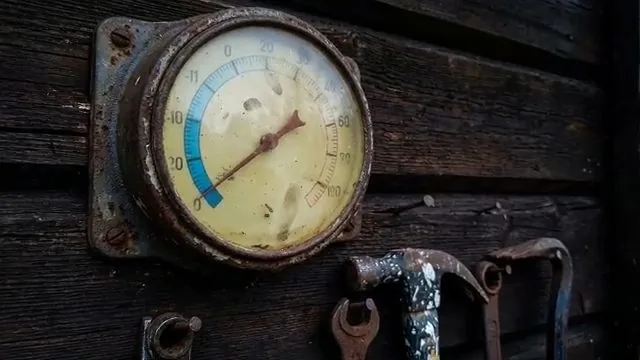 Temperature gauge reading taken on a frozen supply line