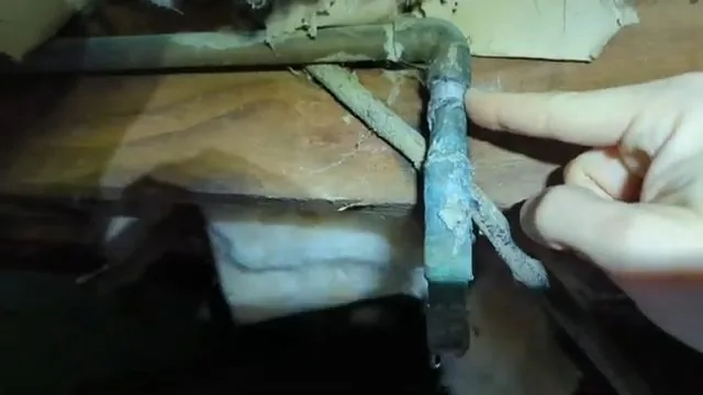 Corroded copper pipe found inside a crawlspace
