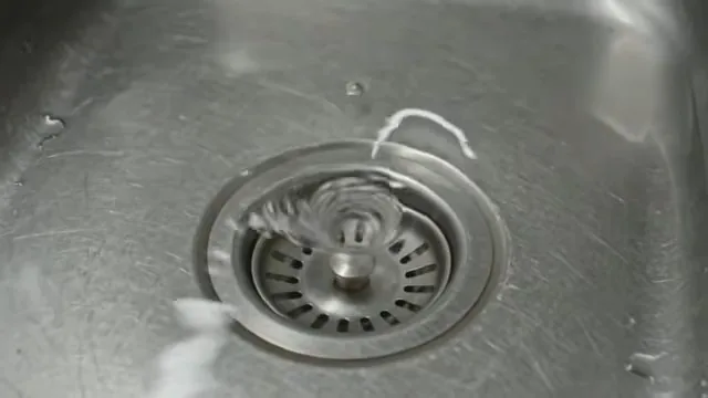 Dirty P-trap removed from beneath a sink before manual cleaning