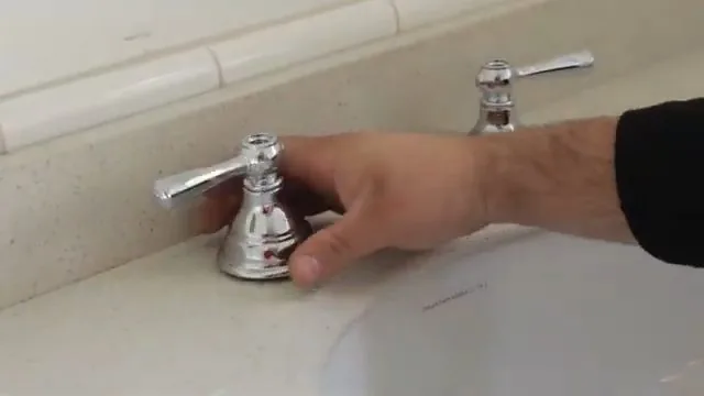 Tank bolts being disconnected during a toilet repair