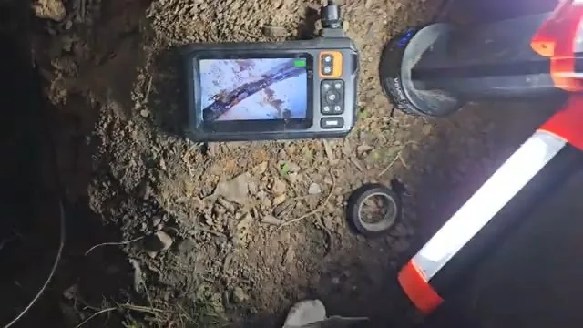 Sewer camera equipment set up at an excavation for a line inspection