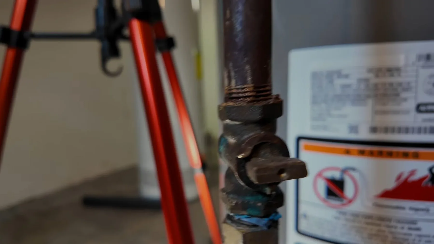 Gas shutoff valve positioned beside a water heater