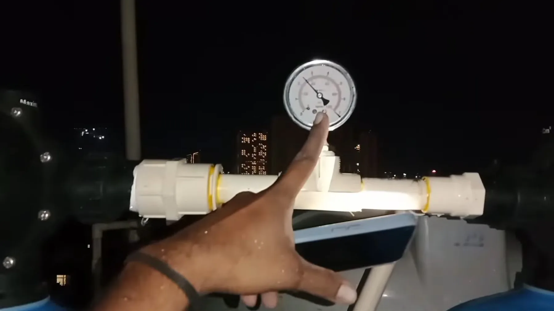 Softener pressure gauge being adjusted during service