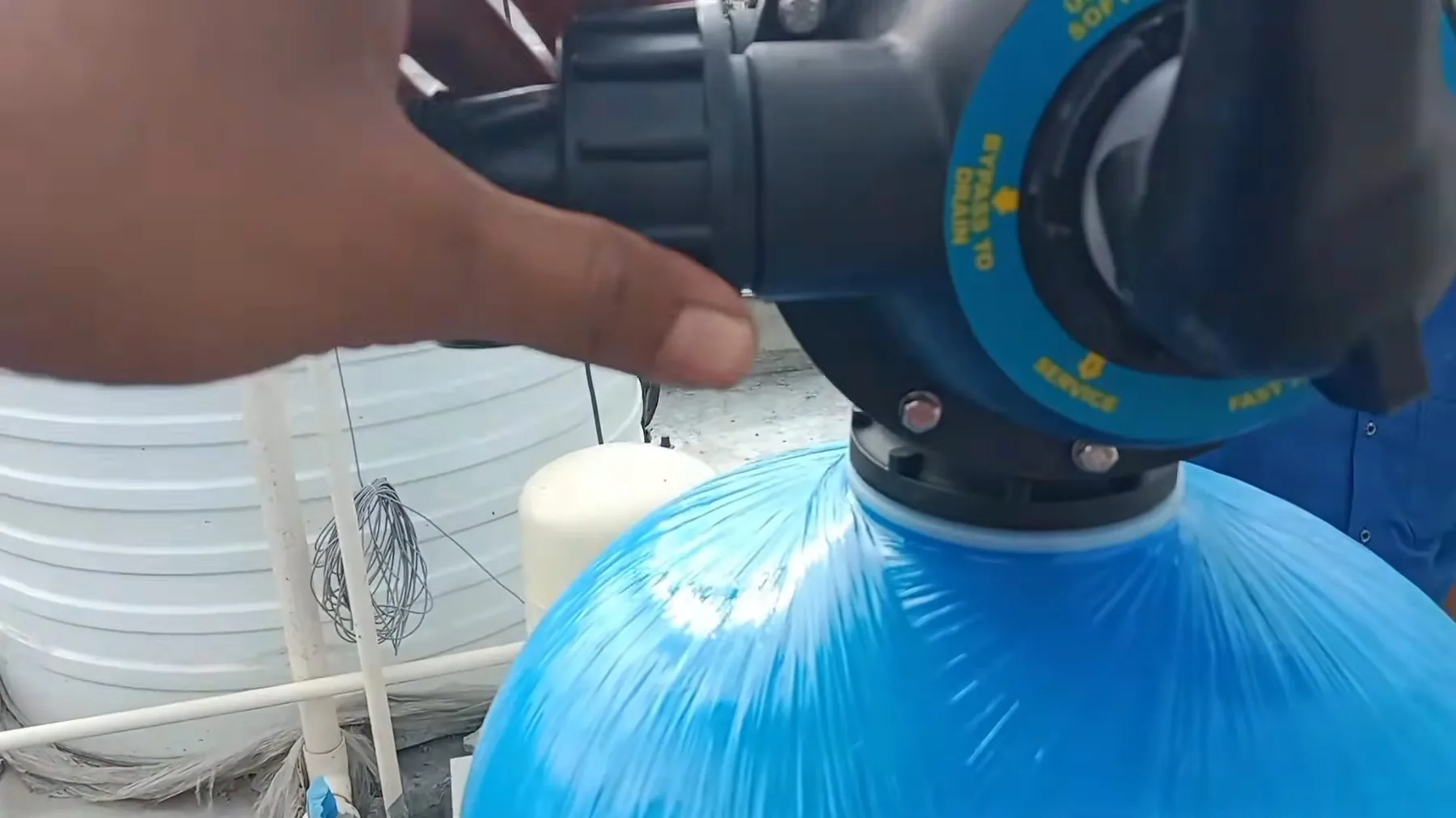 Blue supply pipe being connected to a water softener