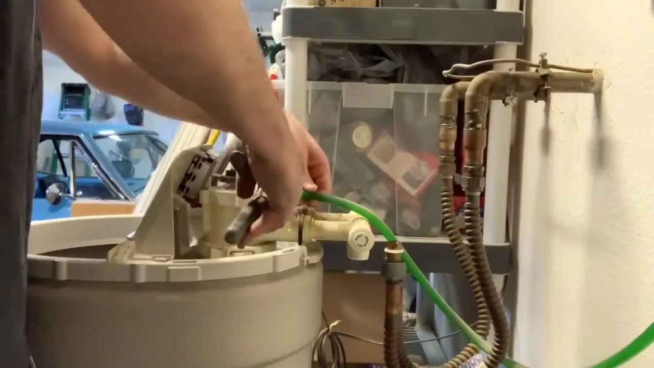 Control valve being removed from a water softener during service