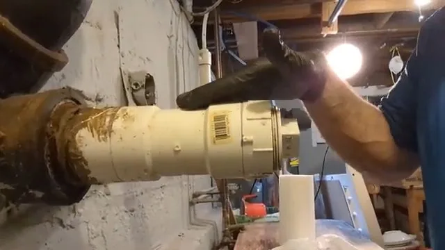 Cleanout plug being removed to prepare for a sewer line camera pass