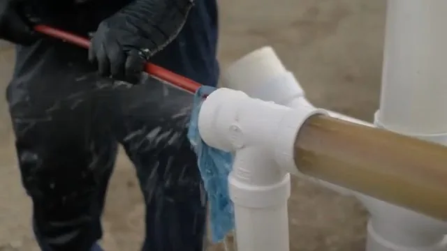 Hydro jetting hose being inserted into a PVC pipe