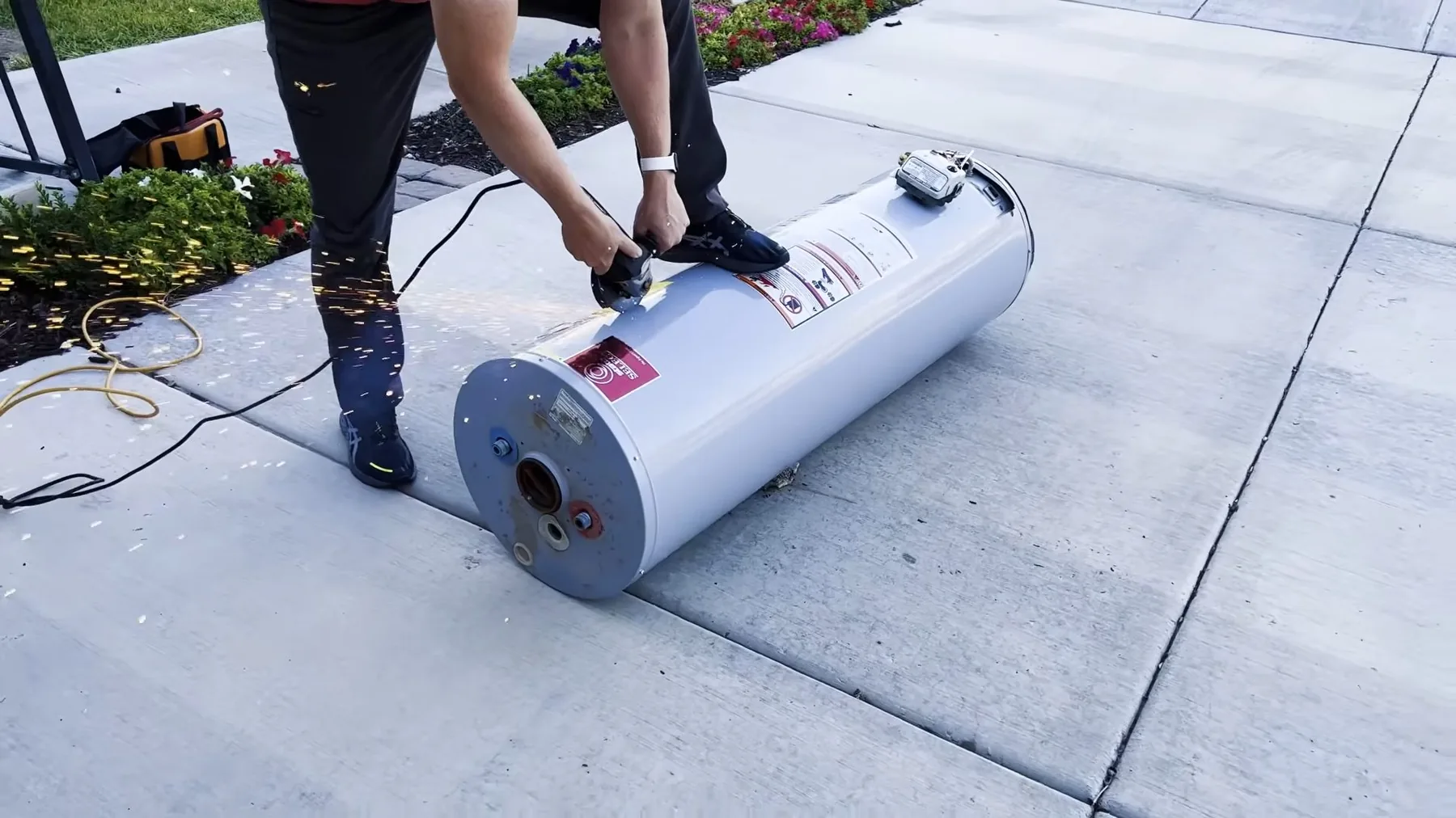 New water heater being moved into place on a hand truck
