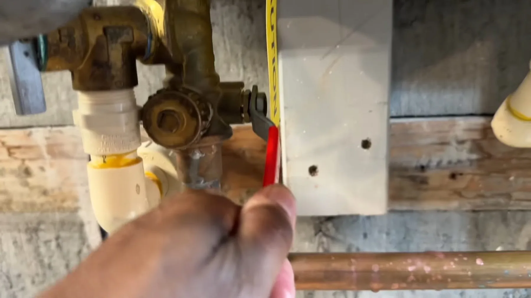 Service valve being opened on a tankless water heater for maintenance