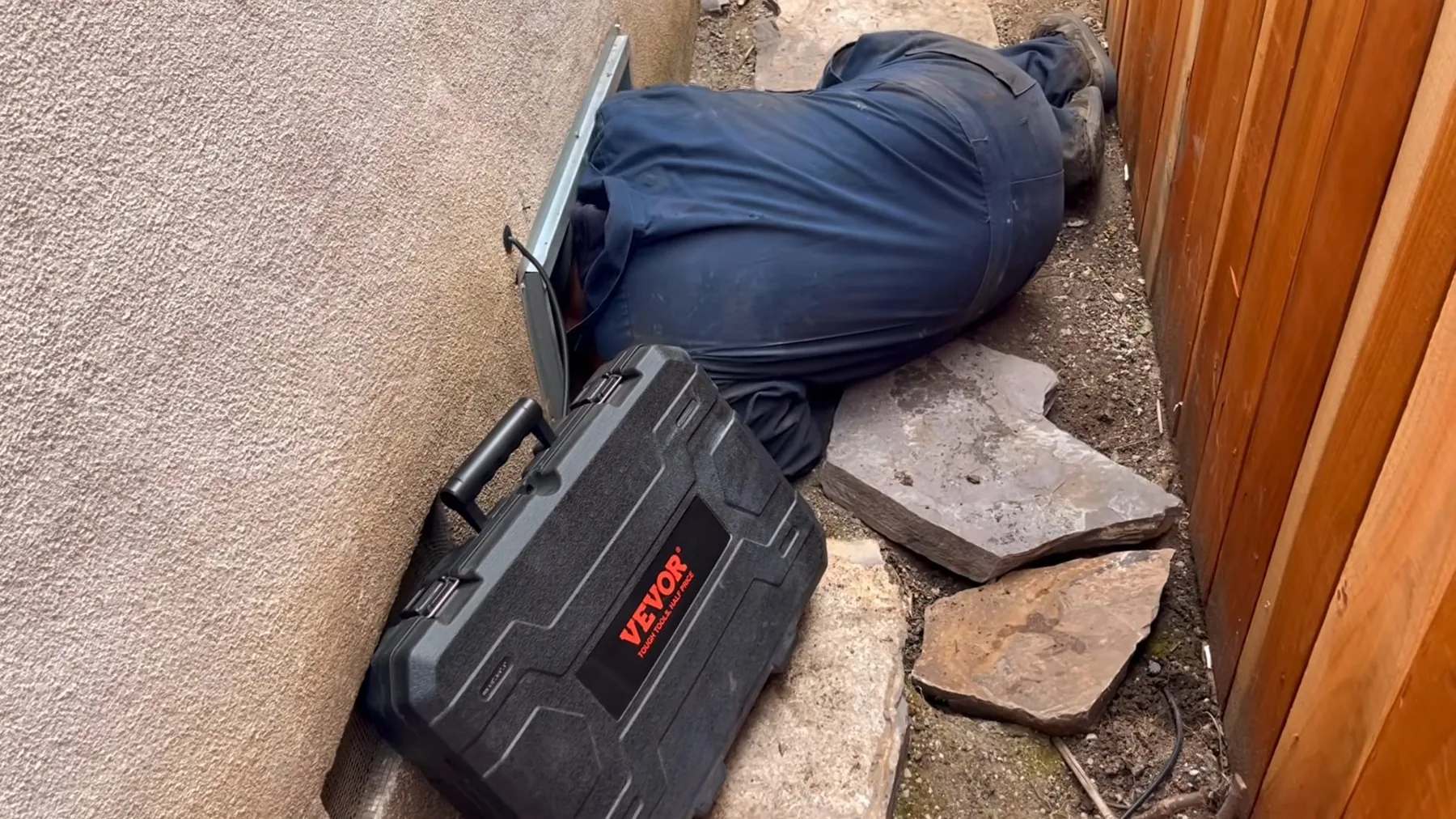 Plumber searching a crawlspace for the source of an unexplained leak