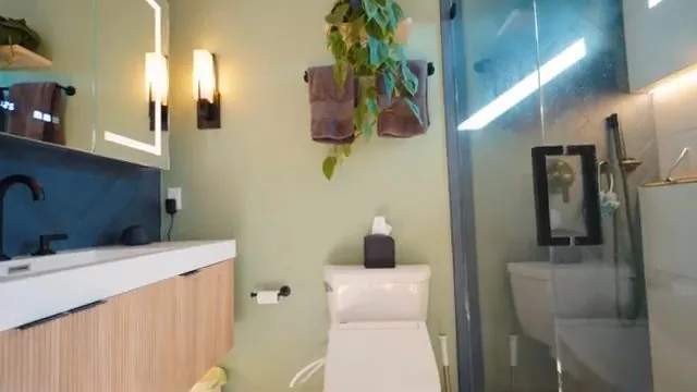 Small bathroom rebuilt after water damage from a plumbing failure