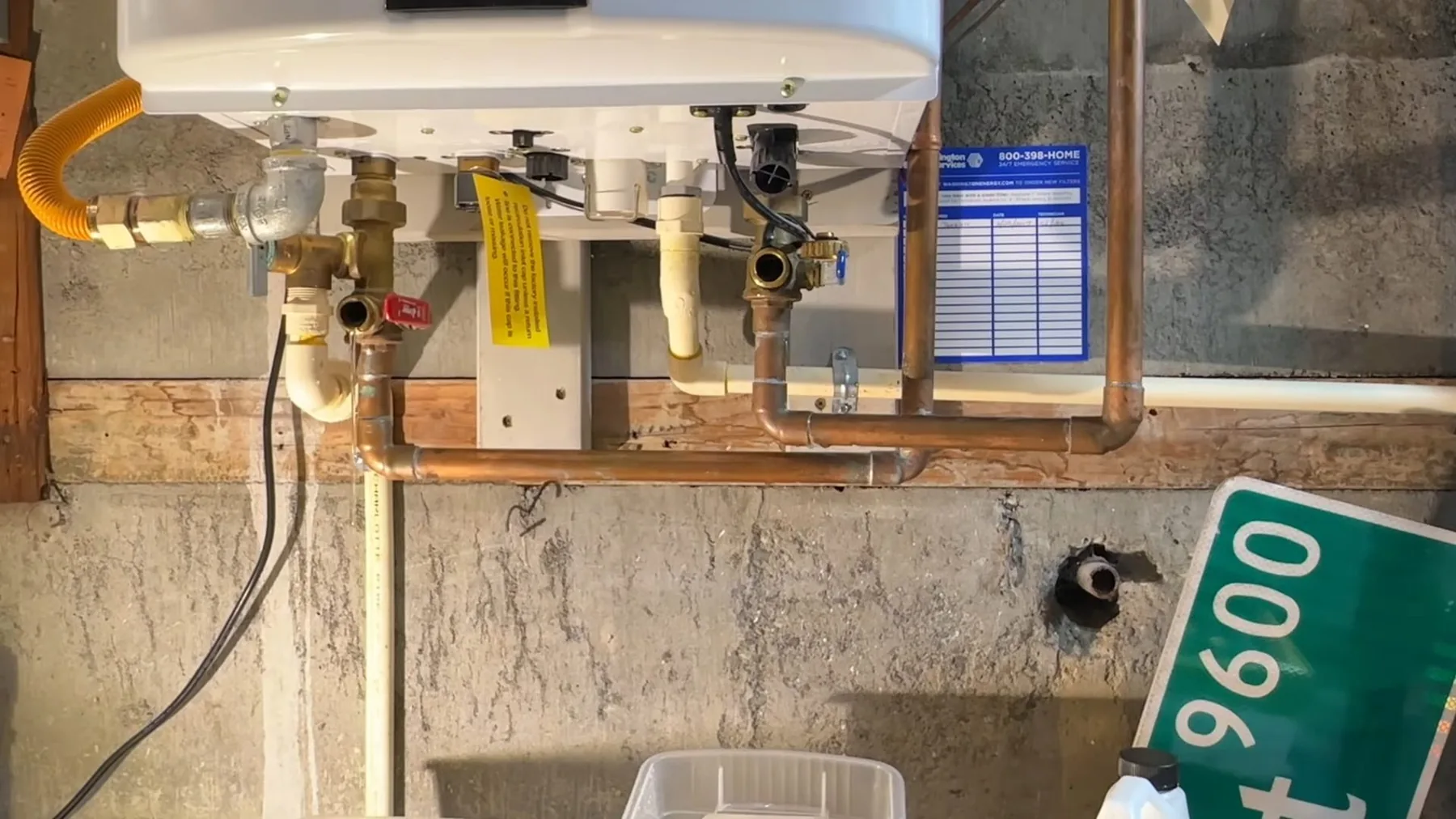 Pipes and valves fitted around a tankless water heater installation